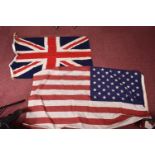 A WWI 1916 DATED UNION JACK FLAG AND A LATER USA FLAG, the Union Jack flag has the broad arrow and