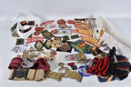 A LARGE SELECTION OF MILITARY BELTS, BUTTONS AND SHOULDER TITLES ETC, this lot includes belts for