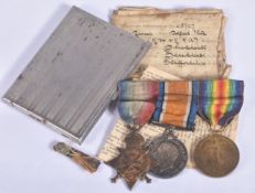 A WWI 1914 MONS STAR TRIO OF MEDALS, associated paperwork and a silver plated cigarette case, the