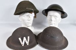 FOUR BRITISH MILITARY STEEL HELMETS, to include a green helmet with liner and replacement chin strap