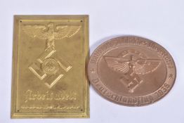 A NAZI GERMANY NSFK TABLE MEDAL AND A RAD PLAQUE, the table medal has the year 1938 on the front and
