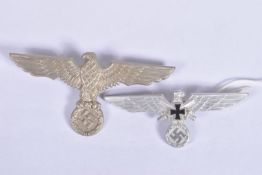 TWO NAZI GERMANY OFFICERS CAP EAGLES, both are silver in colour and the larger one has two lugs