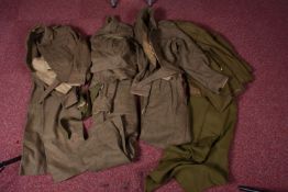 A QUANTITY OF MILITARY NUMBER TWO DRESS UNIFORMS AND BATTLEDRESS, to include a 1949 pattern blouse
