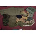 A QUANTITY OF MILITARY RELATED ITEMS, to include four groundsheets, four olive green t shirts,