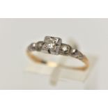 A THREE STONE DIAMOND RING, set with a round brilliant cut diamond and two single cuts in a white