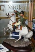A FRANKLIN MINT PORCELAIN FIGURE 'NAPOLEON', designed by Ronald Van Ruyckevelt, mounted on a