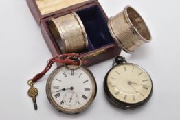 TWO SILVER POCKET WATCHES AND A PAIR OF SILVER NAPKIN RINGS, the first an open face pocket watch key