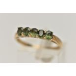 A 9CT GOLD FIVE STONE RING, set with a row of five oval cut green sapphires, each claw set to a