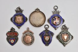 AN ASSORTMENT OF SILVER MEDALS, seven sporting medals, four with gold embellishments, six hallmarked