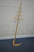 A BESPOKE MAPLE MUSIC STAND, with eight height levels, on a shaped base, height 167cm (condition -