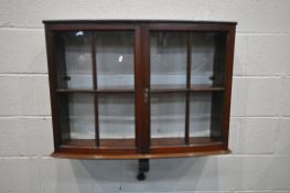 AN EDWARDIAN MAHOGANY WALL MOUNTED TWO DOOR CABINET, width 84cm x depth 23cm x height 84cm (