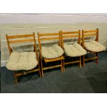 FOUR MODERN BEECH SLATTED FOLDING CHAIRS, with loose cushions