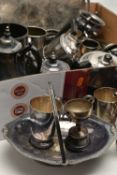 A BOX OF ASSORTED WHITE METAL WARE, to include two trays, cups, a silver plate basket tray, teapots,
