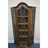 AN OAK CANTED SINGLE DOOR DISPLAY CABINET, width 107cm x depth 31cm x height 194cm, along with