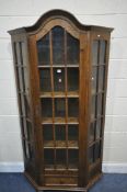 AN OAK CANTED SINGLE DOOR DISPLAY CABINET, width 107cm x depth 31cm x height 194cm, along with