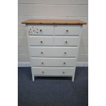 AN IKEA CHEST OF SEVEN DRAWERS, with a white paint effect finish and a pine top and pine handles,