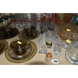 A GROUP OF GLASSWARE, comprising a mid-century amber coloured lemonade set, four whisky tumblers and