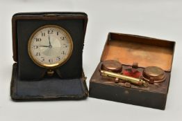 A DESK TOP INK WELL AND A TRAVEL CLOCK, boxed double ink well, together with a cased manual wind