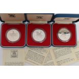 THREE CASED 1977 SILVER JUBILEE COMMEMORATIVE COINS, diameter 38.61mm, each approximately 28.276