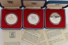 THREE CASED 1977 SILVER JUBILEE COMMEMORATIVE COINS, diameter 38.61mm, each approximately 28.276