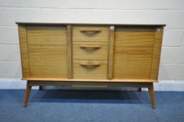 A MID CENTURY ALFRED COX TEAK SIDEBOARD, with two cupboard doors, flanking three drawers, the top