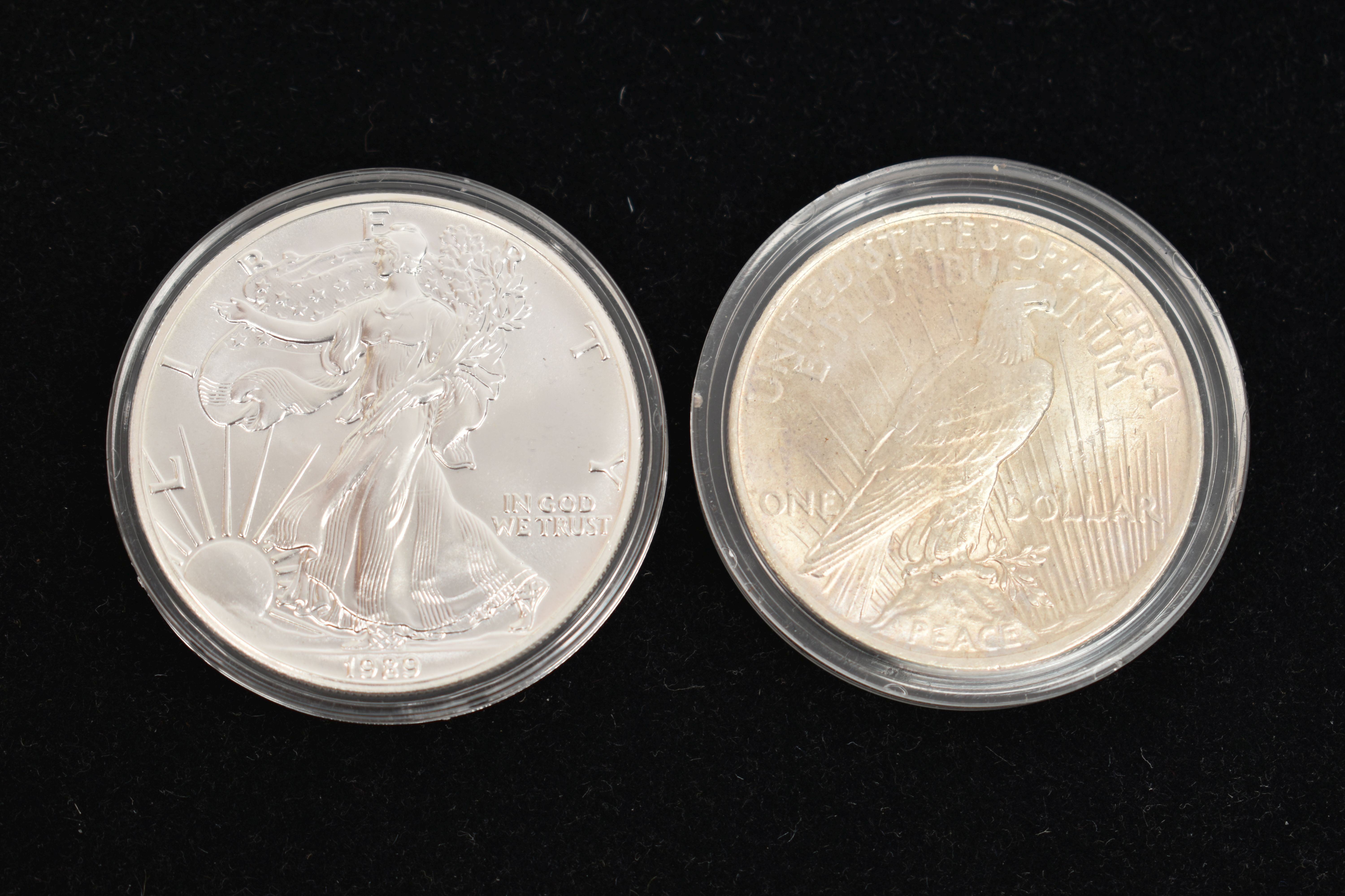 TWO SILVER UNITED STATES OF AMERICA ONE DOLLAR COINS, each in a protective capsule, 1922 and 1929 - Image 2 of 2