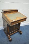 A REGENCY ROSEWOOD AND MARQUETRY INLAID DAVENPORT, with four drawers, and dummy drawers, width