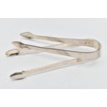TWO SILVER SUGAR TONGS, the first pair detailed with a bright cut pattern, partially hallmarked 'WC'