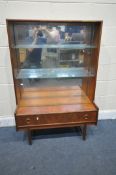 A MID CENTURY TURNIDGE OF LONDON TEAK GLAZED BOOKCASE, with a mirror back and a single drawer, width