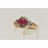 A 9CT GOLD RUBY AND DIAMOND CLUSTER RING, set with a central oval cut ruby flanked with circular cut