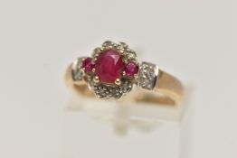A 9CT GOLD RUBY AND DIAMOND CLUSTER RING, set with a central oval cut ruby flanked with circular cut