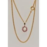 A YELLOW METAL GEM SET PENDANT AND CHAIN, the pendant of an oval cluster set with a central oval