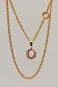 A YELLOW METAL GEM SET PENDANT AND CHAIN, the pendant of an oval cluster set with a central oval