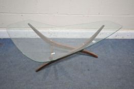A MID CENTURY TEAK SCULPTURAL BOOMERANG GLASS TOP COFFEE TABLE, designed by Forest Wilson, on a teak