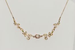 A YELLOW METAL AND OPAL NECKLACE, centrally set with a collect set opal in a rose metal mount,