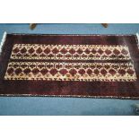 A RED WOOLLEN RUG, with a repeating pattern, 180cm x 88cm (condition report: -good)