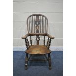 A 19TH CENTURY ELM WINDSOR ARMCHAIR, with spindled backrest, turned supports and legs, united by