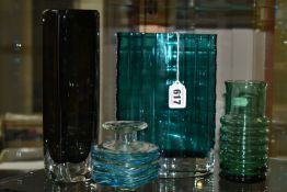 FOUR PIECES OF COLOURED STUDIO GLASS, comprising a navette shaped teal coloured vase with fluted
