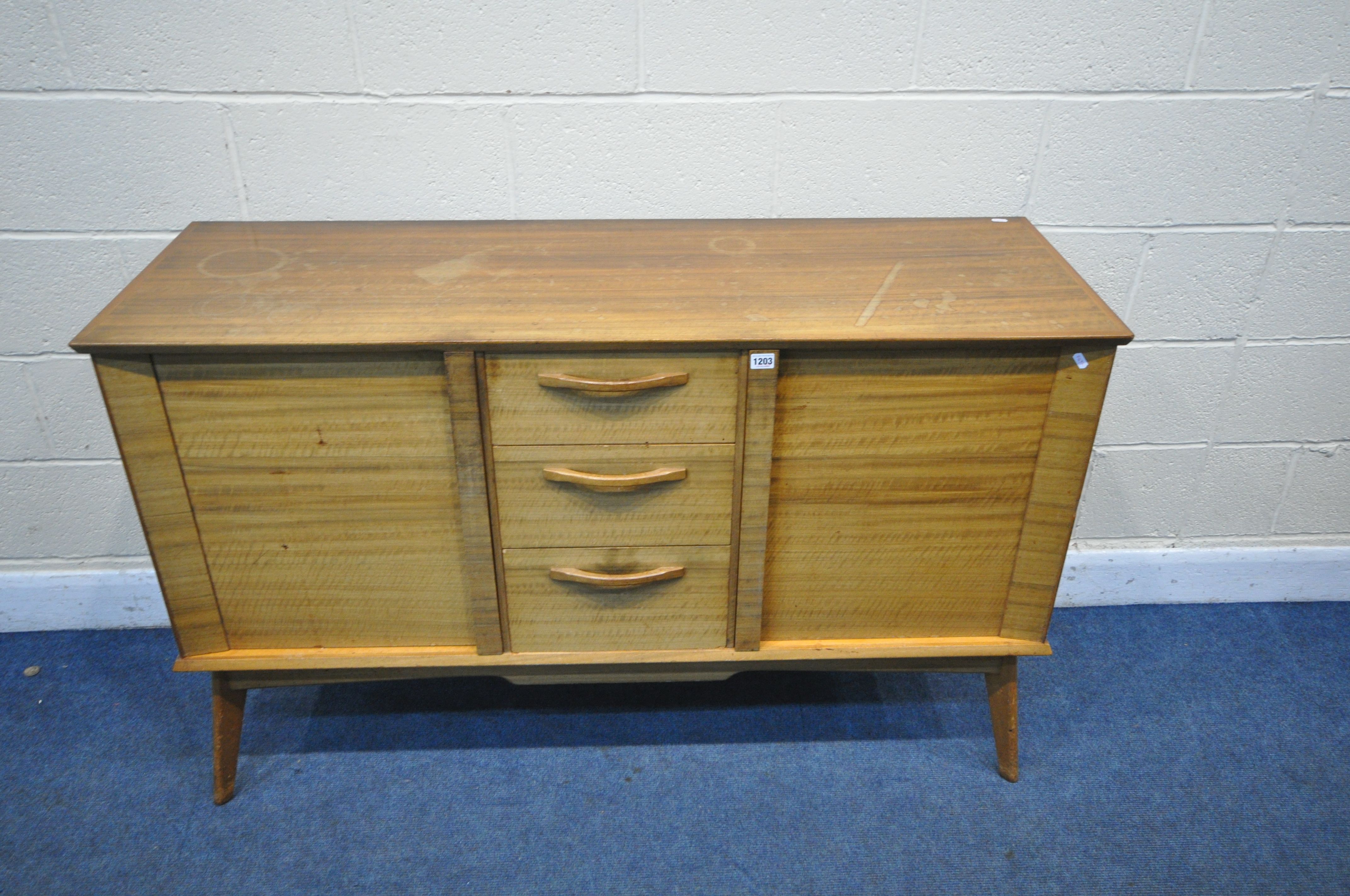 A MID CENTURY ALFRED COX TEAK SIDEBOARD, with two cupboard doors, flanking three drawers, the top - Image 2 of 7