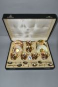 A CASED SET OF SIX ROYAL WORCESTER COFFEE CUPS AND SAUCERS AND SIX SILVER GILT COFFEE SPOONS, the