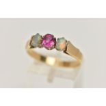 A RUBY AND OPAL RING, a principle set oval cut ruby, set with two oval opals, prong set in yellow