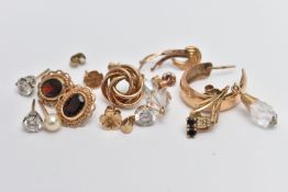 AN ASSORTMENT OF 9CT GOLD AND YELLOW METAL EARRINGS, to include a pair of garnet stud earrings, a