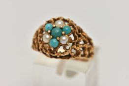 A YELLOW METAL GEMSET DOME RING, a textured open work ring, cluster set with three split pearls