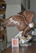A BOXED FRANKLIN MINT 'THE MAJESTIC BALD EAGLE' FIGURE by Ronald Van Ruyckevelt, depicting a bald