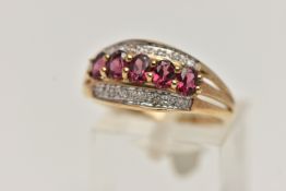 A 9CT GOLD GEM SET RING, five oval cut garnets, prong set in yellow gold, set with single cut