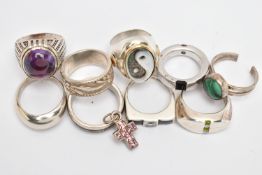 NINE WHITE METAL RINGS AND A CROSS PENDANT, to include a heavy silver, 'Montblanc' band ring set