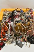A YELLOW PLASTIC BOX OF ASSORTED COSTUME JEWELLERY ITEMS, large quantity of necklaces, bracelets,