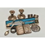 A BOX OF ASSORTED SILVER AND WHITE METAL, to include two napkin rings, a cigarette case, two tea