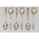 A SET OF SIX SILVER COFFEE SPOONS, six matching spoons with open work detail to the terminations,