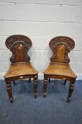 A PAIR OF VICTORIAN OAK HALL CHAIRS (condition report: -aged wear and tear)